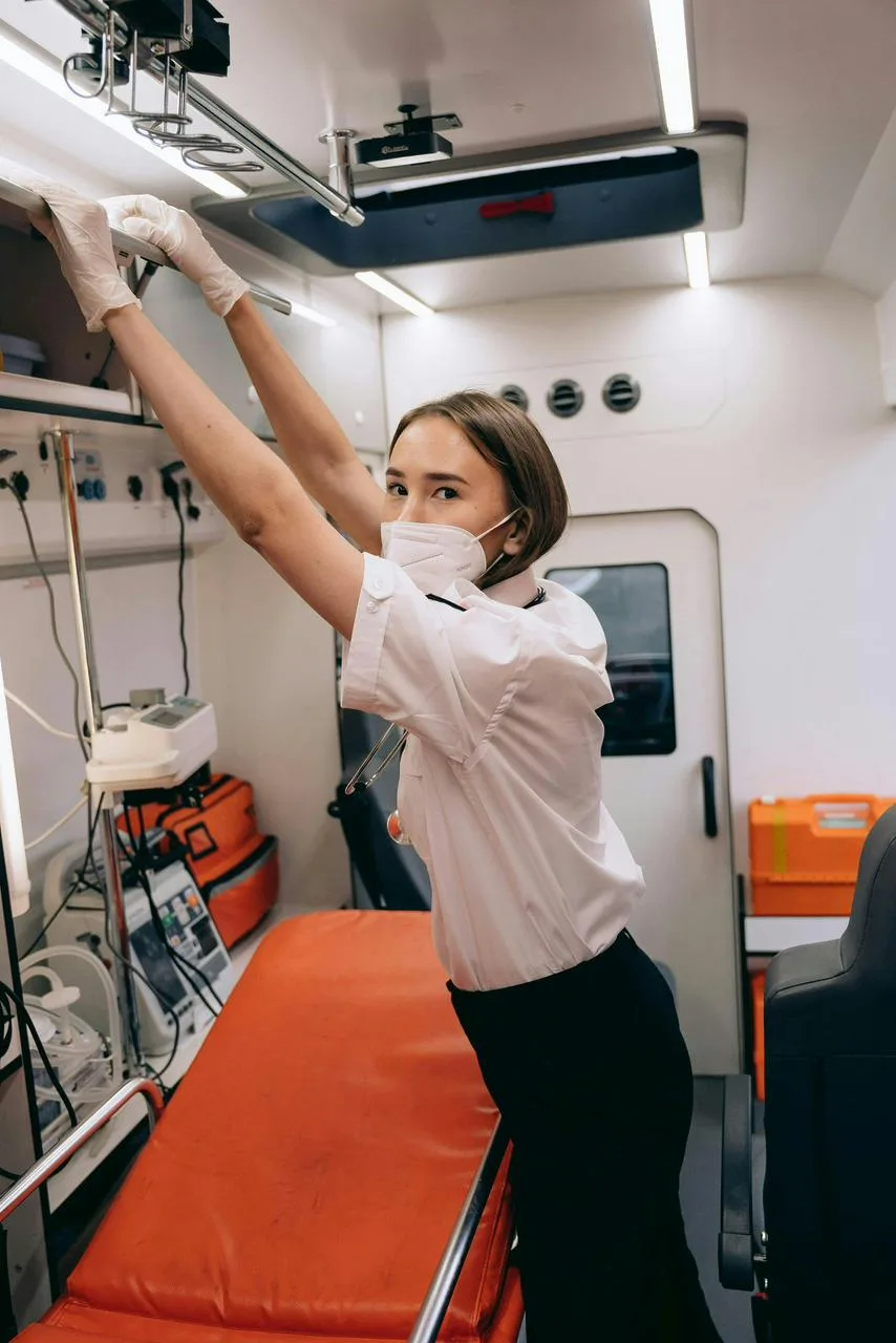 Flight nurse inside a fully equipped medical evacuation air ambulance